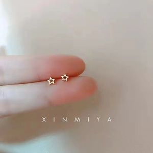 Gold plated minimalist star earrings.